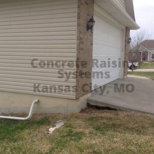 a void under concrete driveway is pictured that Concrete Raising Systems, Kansas City fixed!