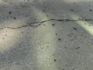 Cracks in the driveway could be a sign of a void. Get cracks in the driveway repaired with mud jacking foam.